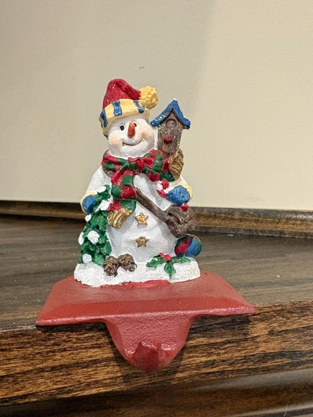 Vintage cast iron stocking holder, snowman with birdhouse, 3.5" tall, red base